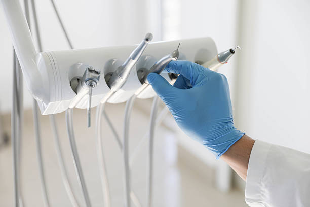 Professional Invisalign Clear Aligners technician working in Delft Colony, CA